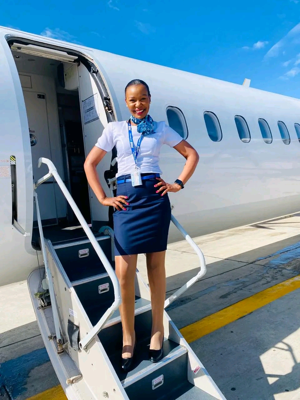 Fly748 cabin crew welcoming passengers at the aircraft door